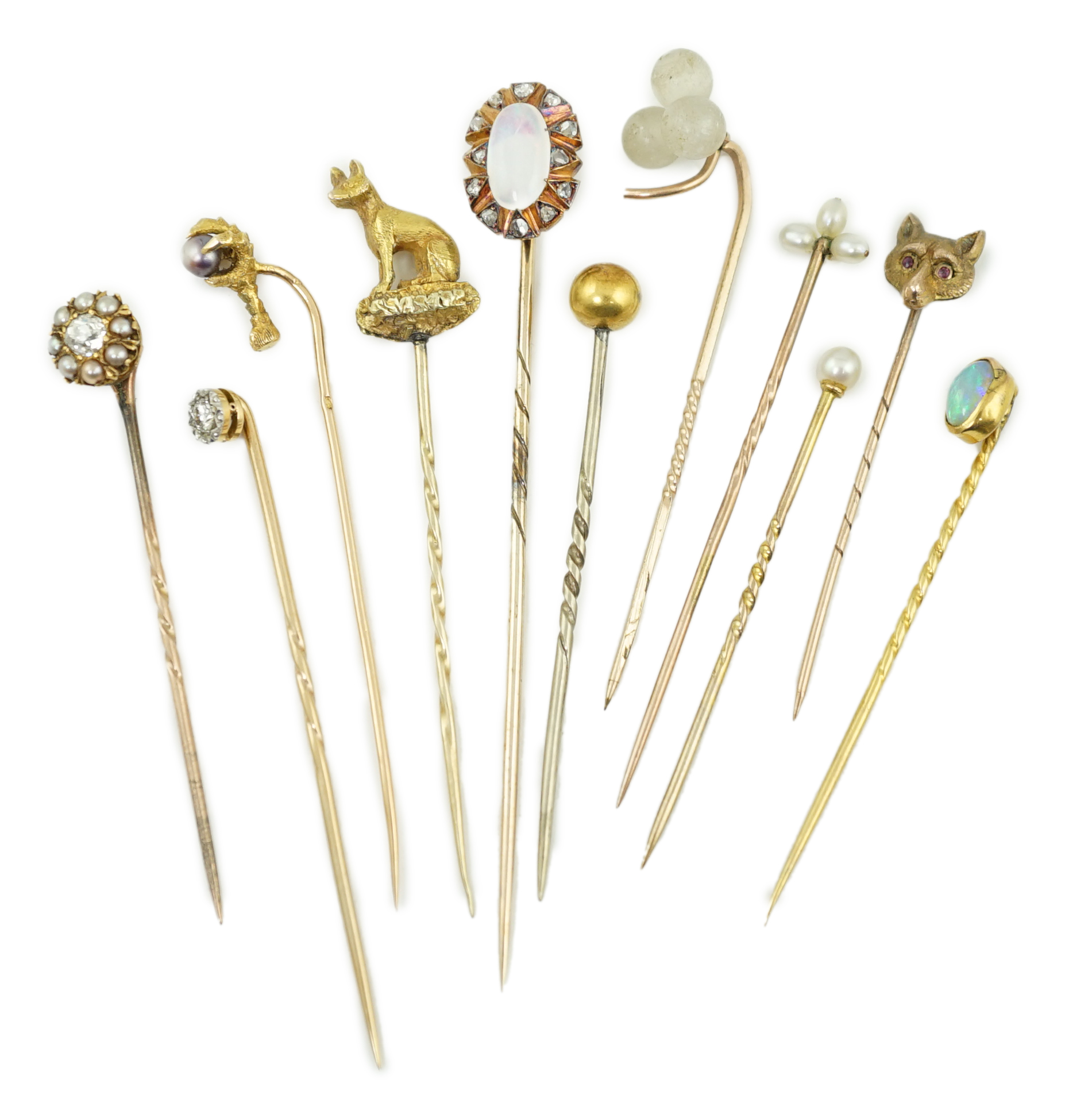 A collection of eleven assorted early 20th century and later stick pins